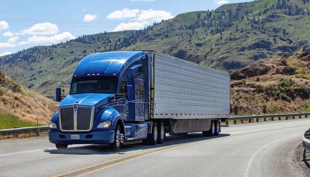 JONES COURIER SERVICES LLC tractor and trailer at dusk